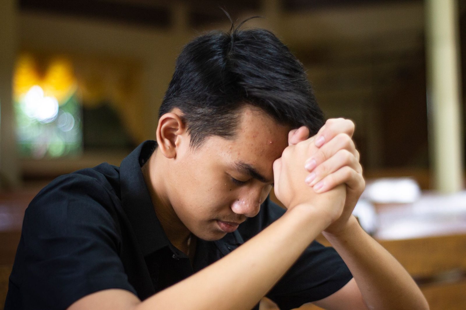 close up of a man praying
